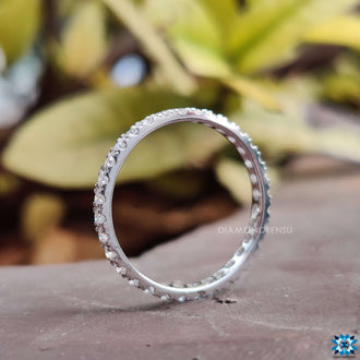 Band moissanite in white gold with a minimalist design.