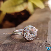 Elegant white gold moissanite ring with sparkling brilliance.