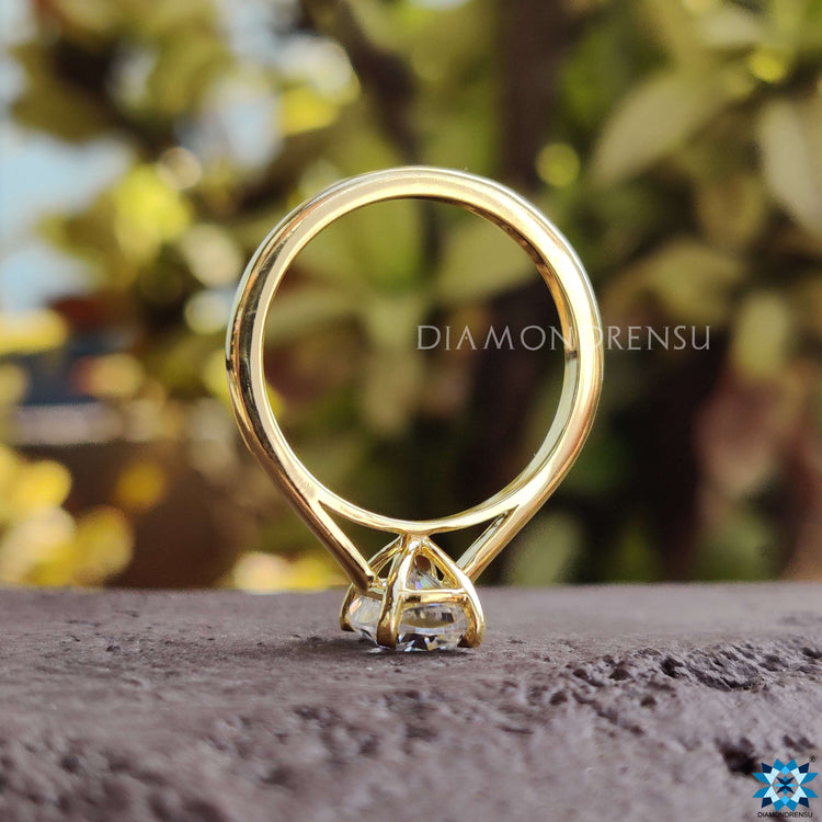 Stunning elongated cushion cut moissanite with a cathedral setting.