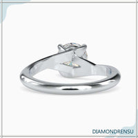 Gorgeous bypass ring featuring a round cut diamond and lab grown diamond.