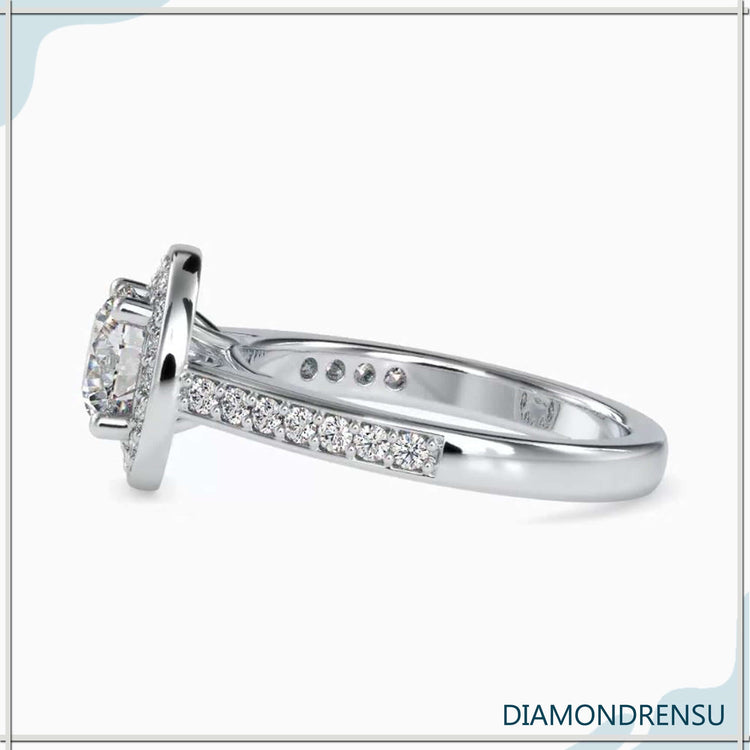 Gorgeous pave engagement ring with a round diamond halo and prong setting.