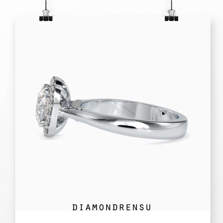 Gorgeous cushion halo ring with a round brilliant cut diamond and
bridge accent.