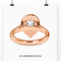 Halo engagement rings pear shaped with a lab grown diamond center.