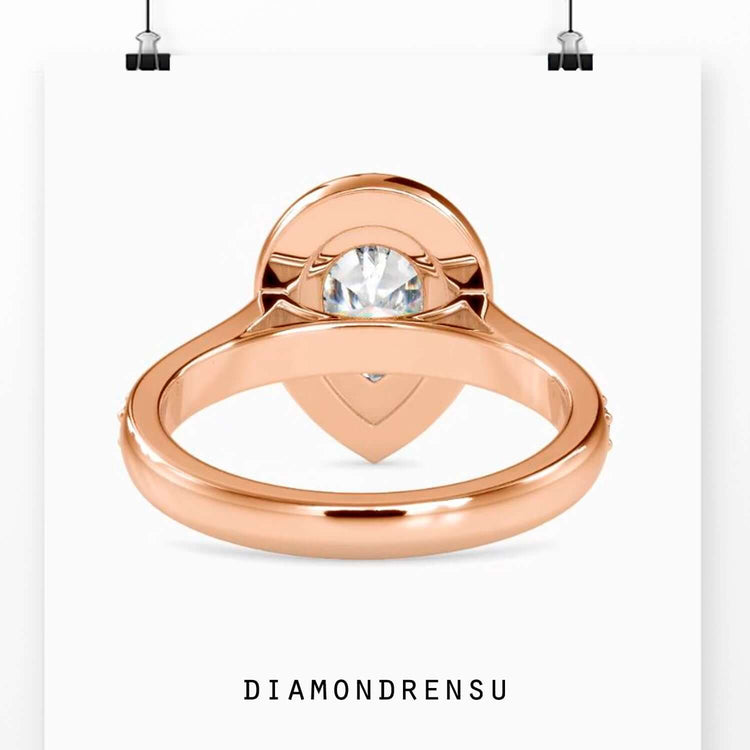 Halo engagement rings pear shaped with a lab grown diamond center.