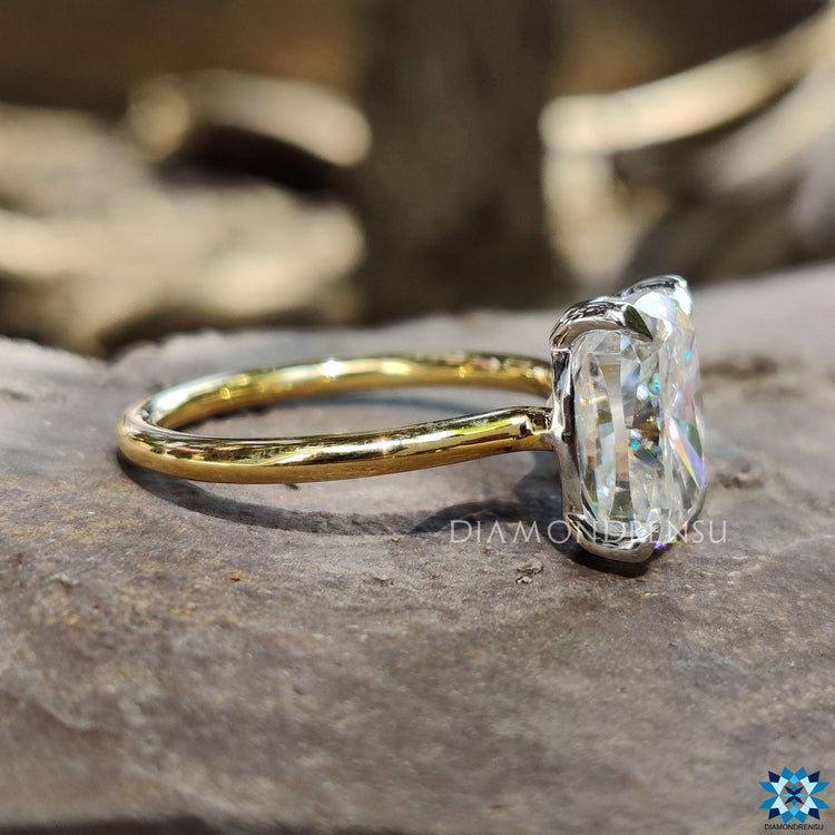 Moissanite elongated cushion cut ring with a radiant finish.