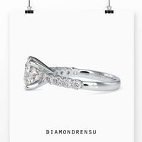 Pave engagement ring with 2 ct oval diamond and yellow gold band