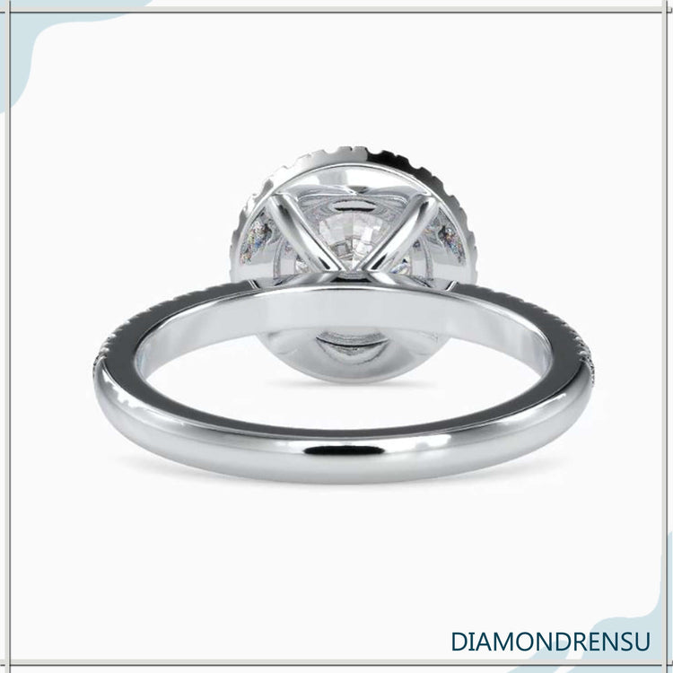 Pave band ring with a 4 prong round engagement ring design, showcasing a halo round diamond.