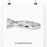 Solitaire ring featuring a princess cut diamond with a prong setting