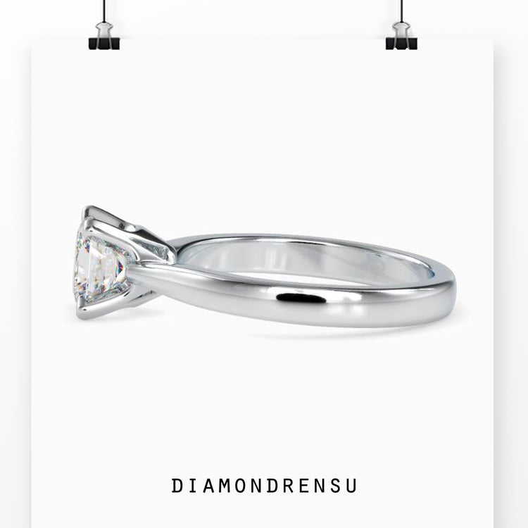 Solitaire ring featuring a princess cut diamond with a prong setting