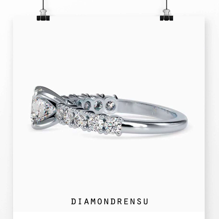 Elegant round diamond engagement ring with a pave setting and lab grown diamond.