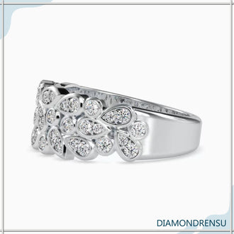 Unique diamond ring with a bezel set diamond in a half eternity wedding band.