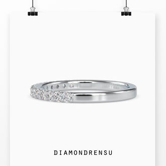 Diamondrensu wedding band featuring round diamonds in a handmade eternity design.