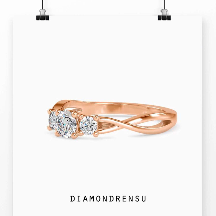 Three diamond engagement ring with a silver and gold twisted ring design for modern elegance.