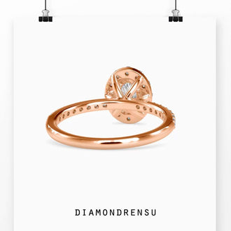 Pave band engagement ring featuring a 4 prong oval engagement ring design with a diamond halo.