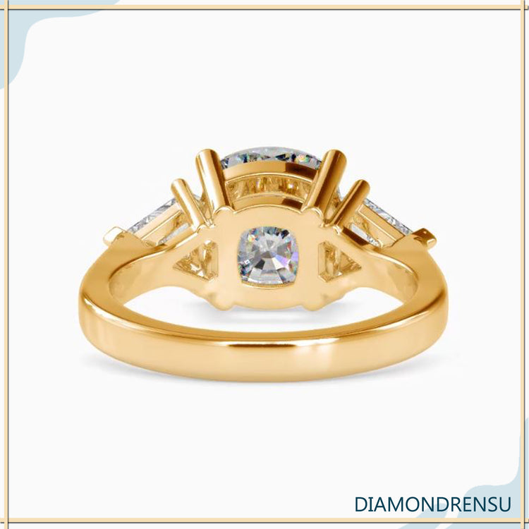 4 prong engagement ring featuring a cushion cut diamond in yellow gold