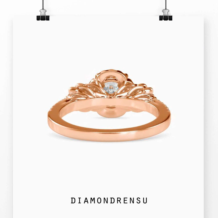 Diamond engagement ring flower design with pave setting accents.