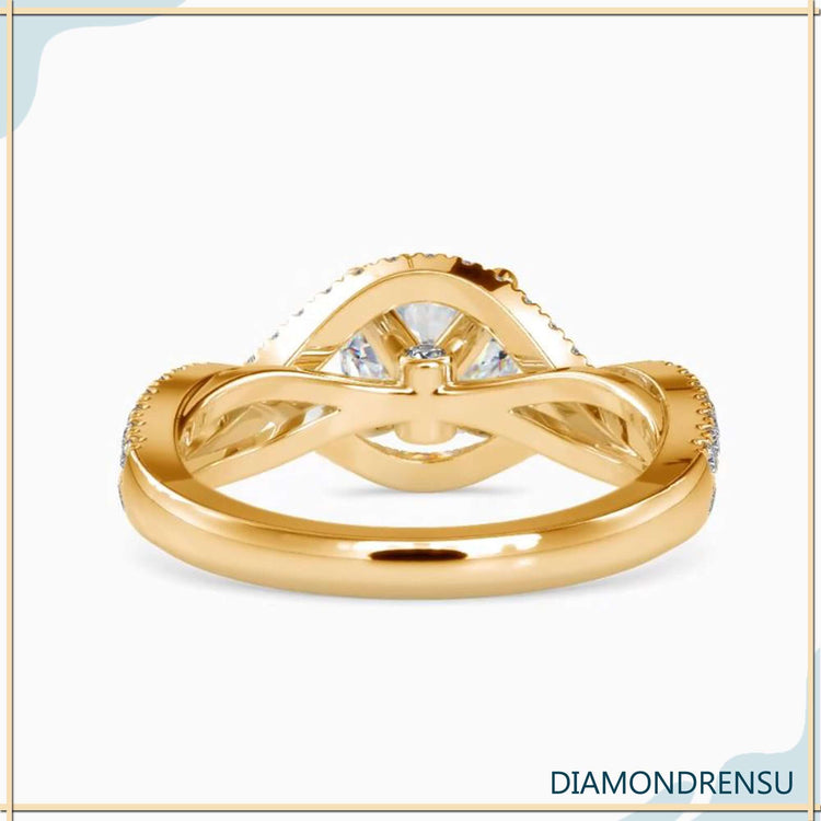 Round brilliant cut diamond ring in a 4 prong round engagement ring setting with a unique design.