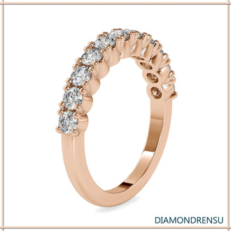 Shared prong eternity band featuring brilliant cut diamonds and handmade craftsmanship.