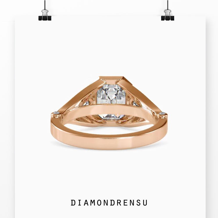 Emerald diamond ring with pear side stones and lab grown diamond