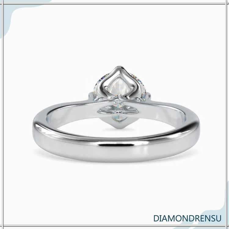 Round engagement ring with side stones for a timeless look.