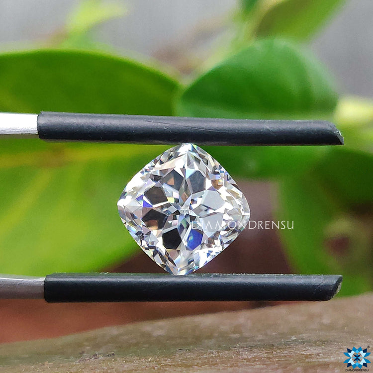 Antique cushion cut moissanite shown for ring or pendant use.