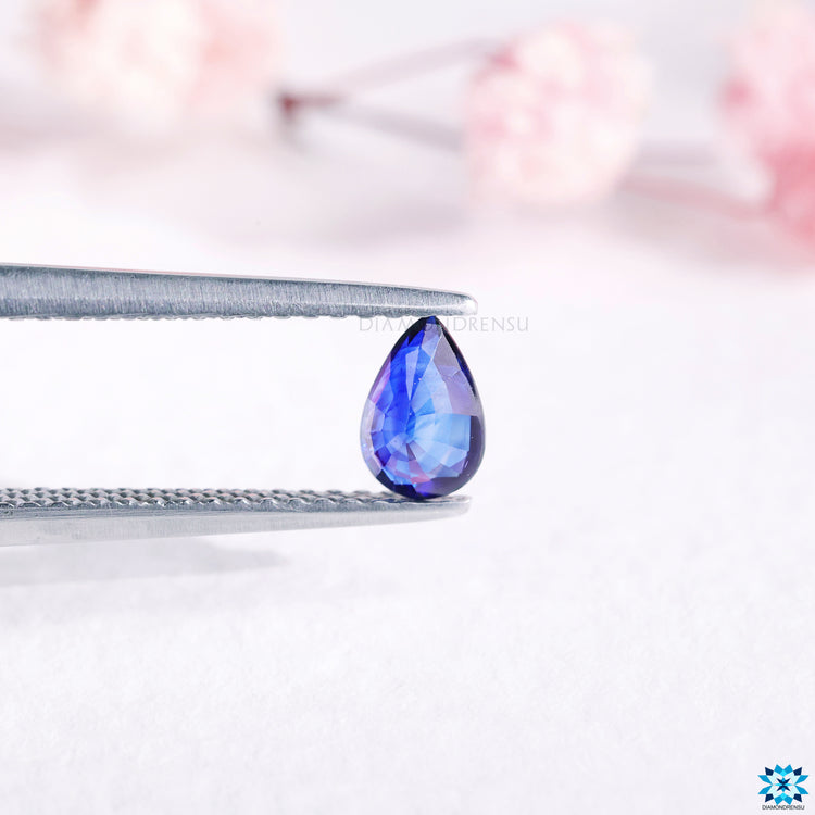 Pear cut birthstone sold as 0.54 carat gemstone and blue gemstone.