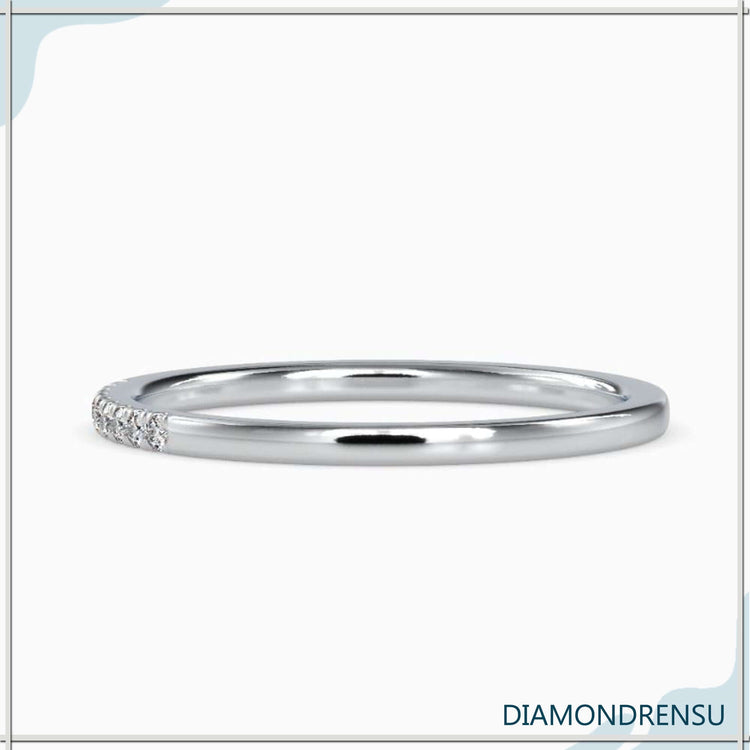 Handmade jewelry in a diamondrensu band with a u prong eternity
setting.