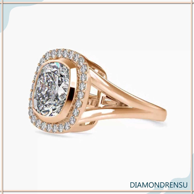 Split shank diamond ring with a cushion cut halo engagement ring style for added elegance.