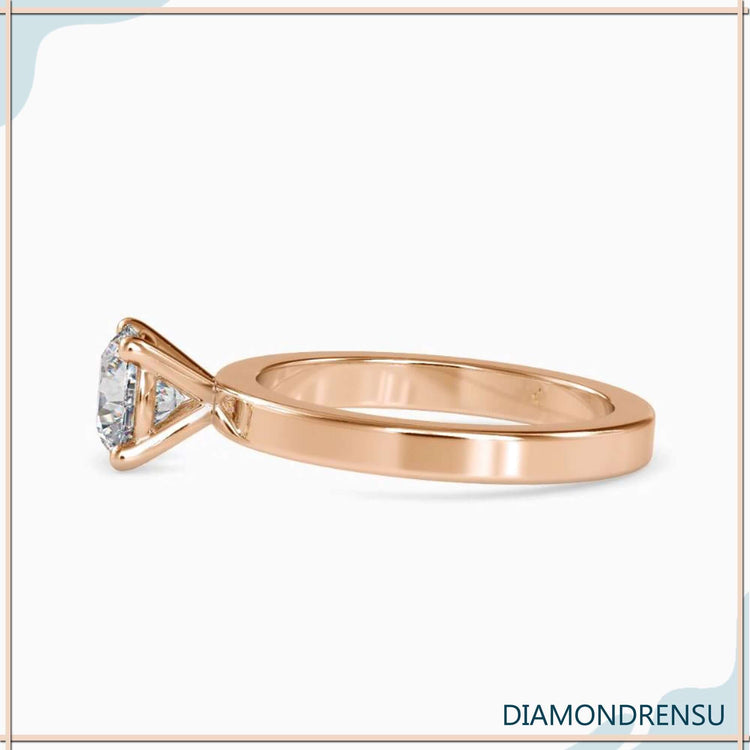 Basket setting engagement ring with a round solitaire diamond for a modern twist.