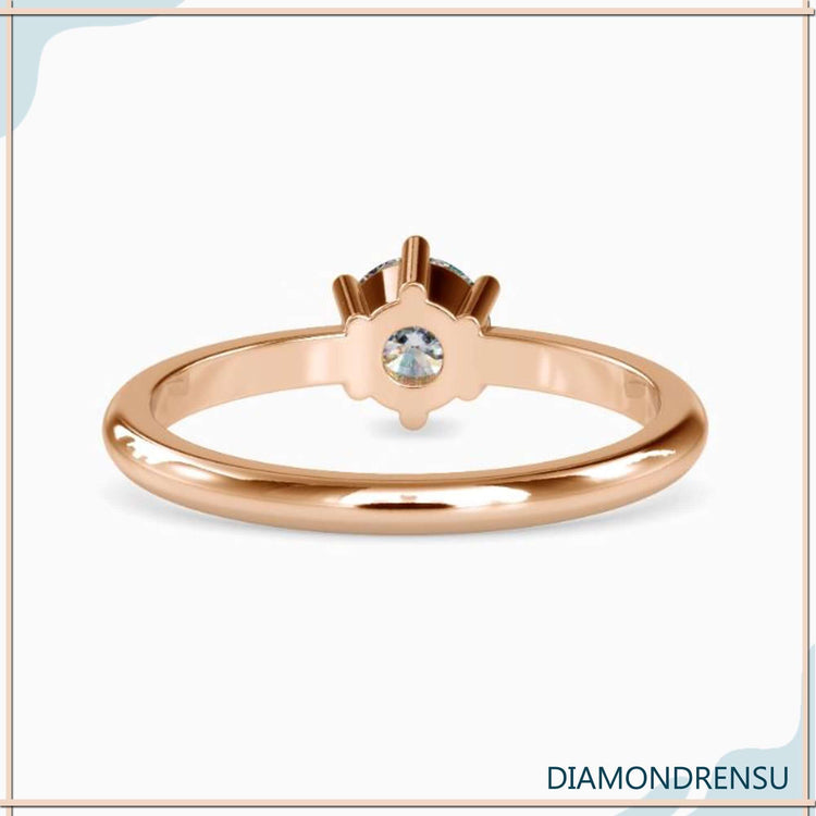 Timeless gold solitaire engagement ring with a six prong setting for extra security.