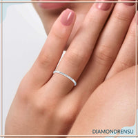 White gold eternity band featuring round diamonds and u prong setting.