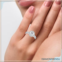 Elegant round ring with a gold halo and diamond accents.