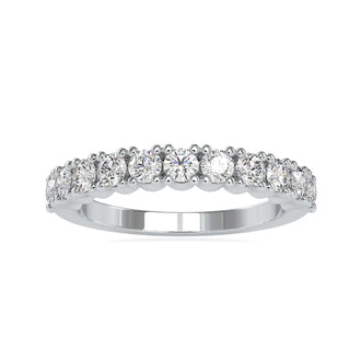Gold wedding band with half eternity diamond band in a round prong setting.