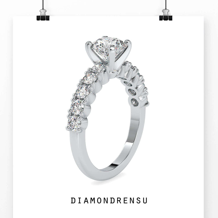 Gorgeous round 4 prong engagement ring with a pave band for extra brilliance.
