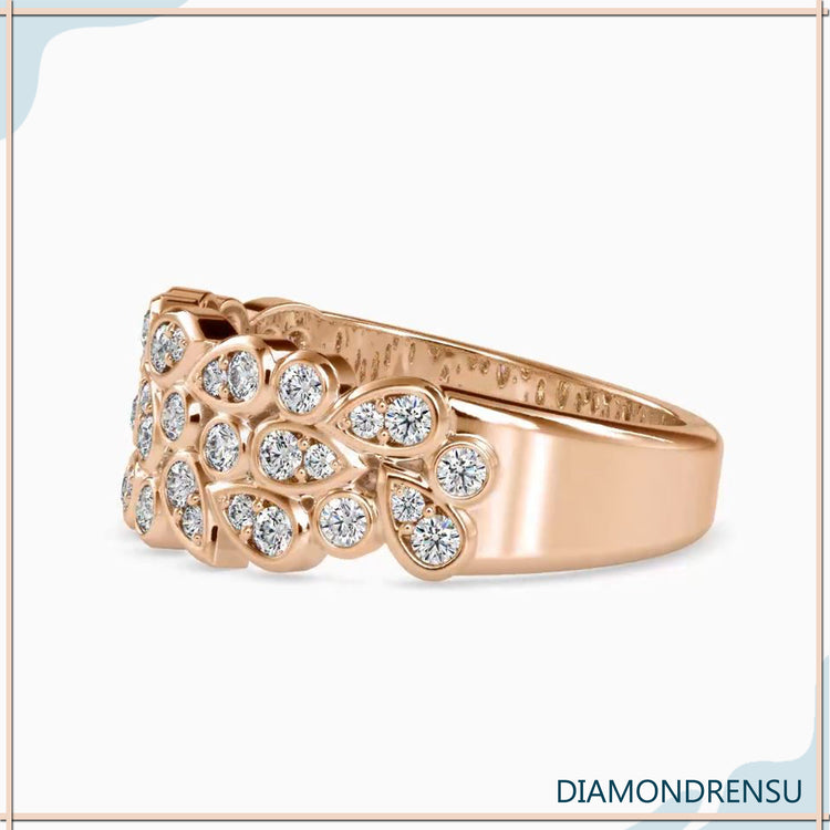 Bezel set pear diamond band in a round brilliant cut for a distinctive wedding ring.