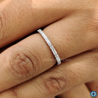 Stunning moissanite band with brilliant stones for a radiant finish on your finger.