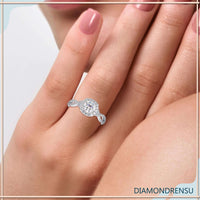 Twisted diamond engagement ring with a gold halo setting.
