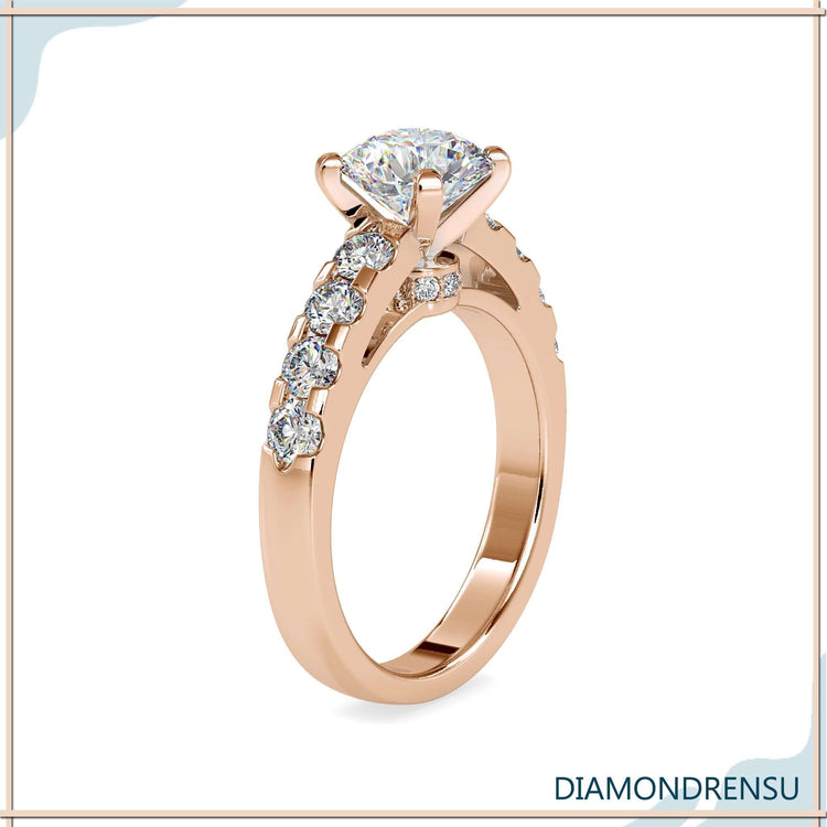 Timeless round diamond ring featuring a hidden halo diamond and pave band.