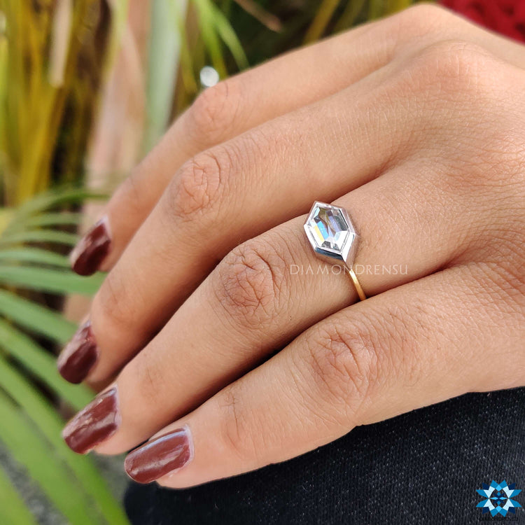 Moissanite east west ring combining style and brilliance in one piece.