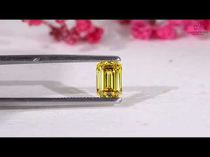 Certified loose yellow diamond emerald cut shape.