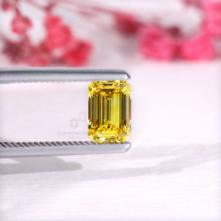 IGI certified loose emerald cut yellow diamond.