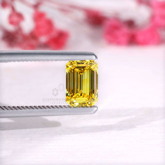 IGI certified loose emerald cut yellow diamond.