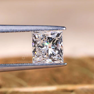 Princess cut lab grown diamond with 1.3 carat weight and crisp shape.