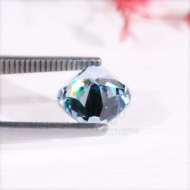 Rare fancy blue color cushion cut diamond is 2.7 carat and IGI certified.