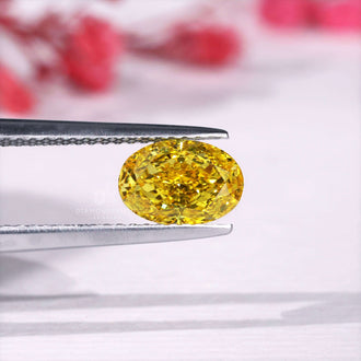 Oval cut loose diamond in vibrant yellow color.
