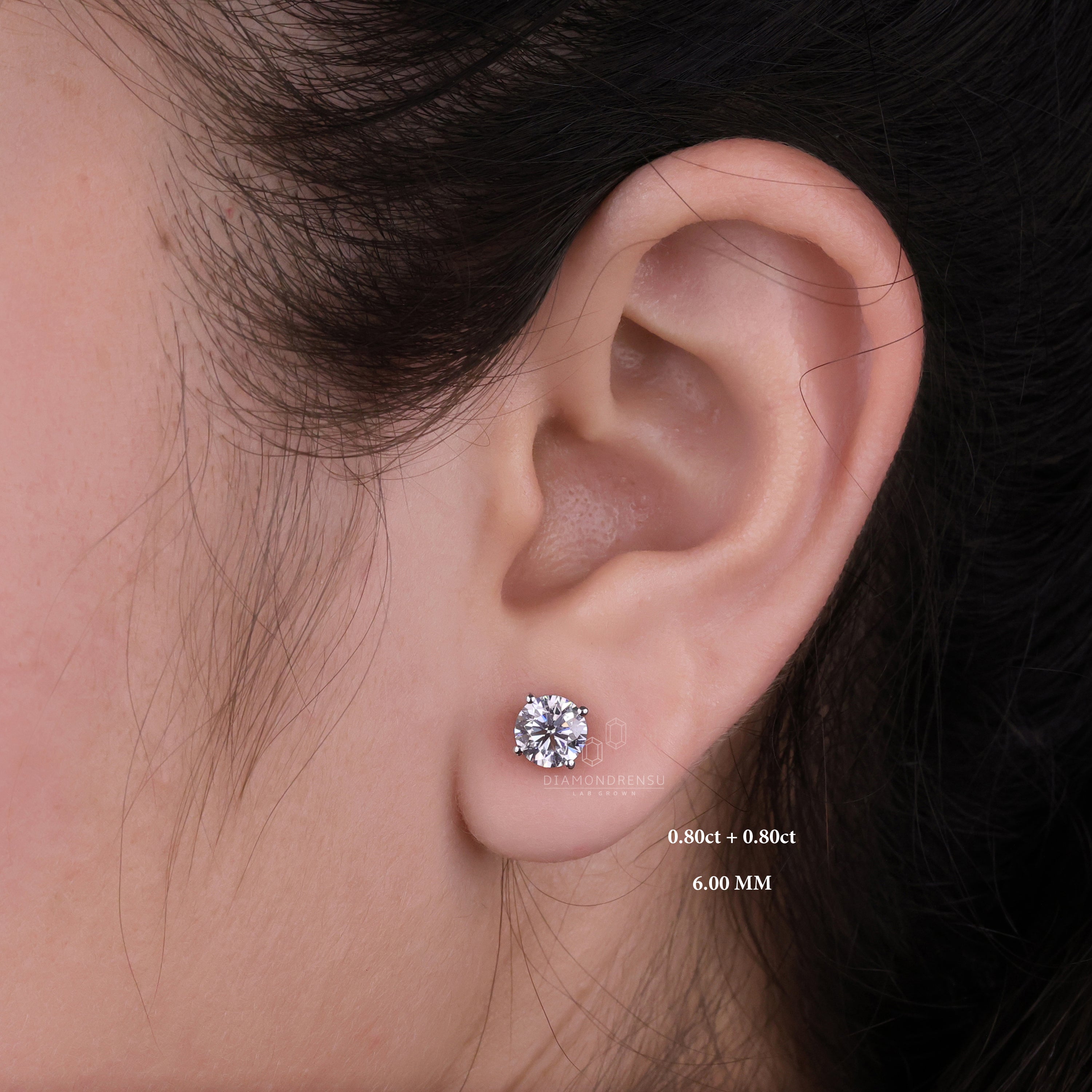 Lab grown diamond earrings worn by a model, demonstrating their versatility and radiant shine in natural light