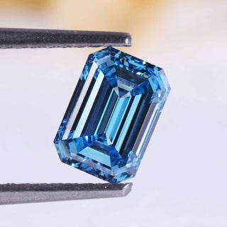 0.86 carat emerald cut lab grown blue diamond.