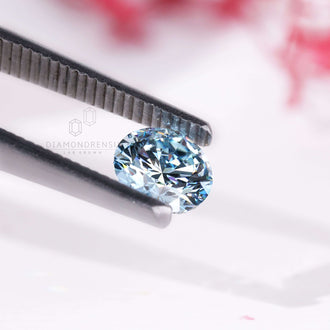 This blue lab grown diamond comes in round shape and is IGI certified.