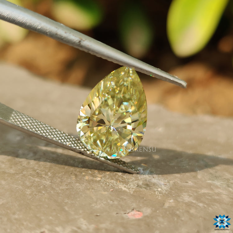 Pear Greenish Yellow Moissanite shown as a single loose stone.