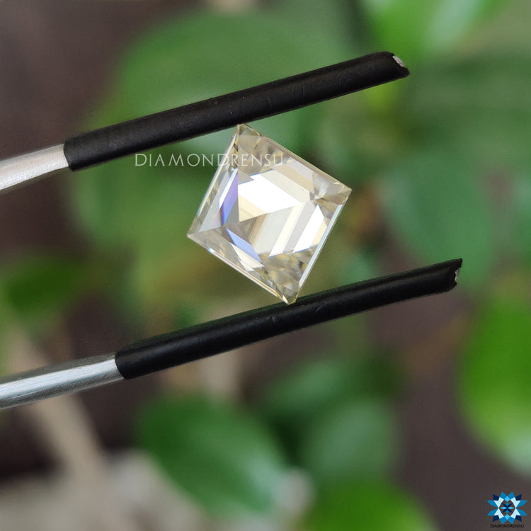 Antique cut moissanite glowing near loose moissanite stone.